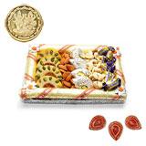 Send Tasty Sweets Arrangement with Diyas to India