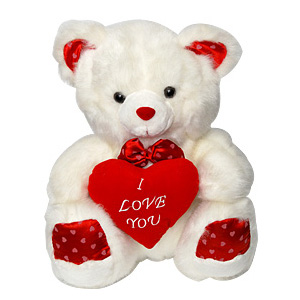 small teddy bear with heart on chest