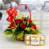 Send 12 Red Roses in a Round Basket wth Ferrero Rocher Gift Hampers to Davangere Send 12 Red Roses in a Round Basket wth Ferrero Rocher Gift Hampers to Davangere