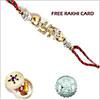 Jewelled Swastik Rakhi with Free Silver Coin  