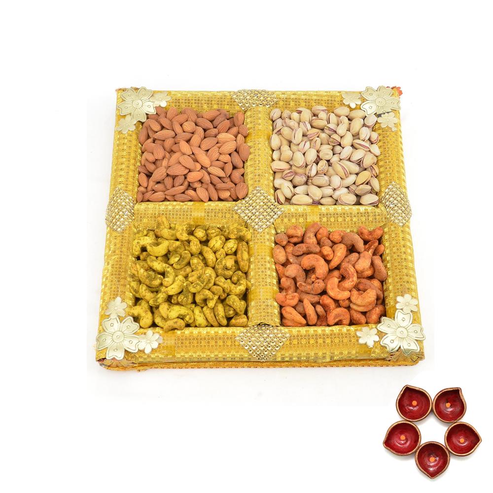 Tasty Dry Fruits in Yellow Thali with Diya