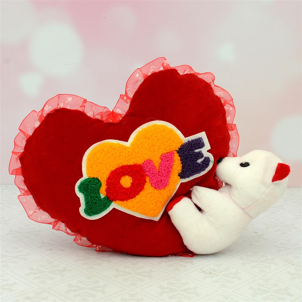 teddy holding heart