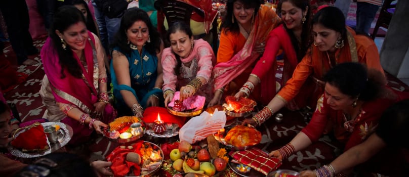 Women Worshipping Karva Chauth Women Worshipping Karva Chauth